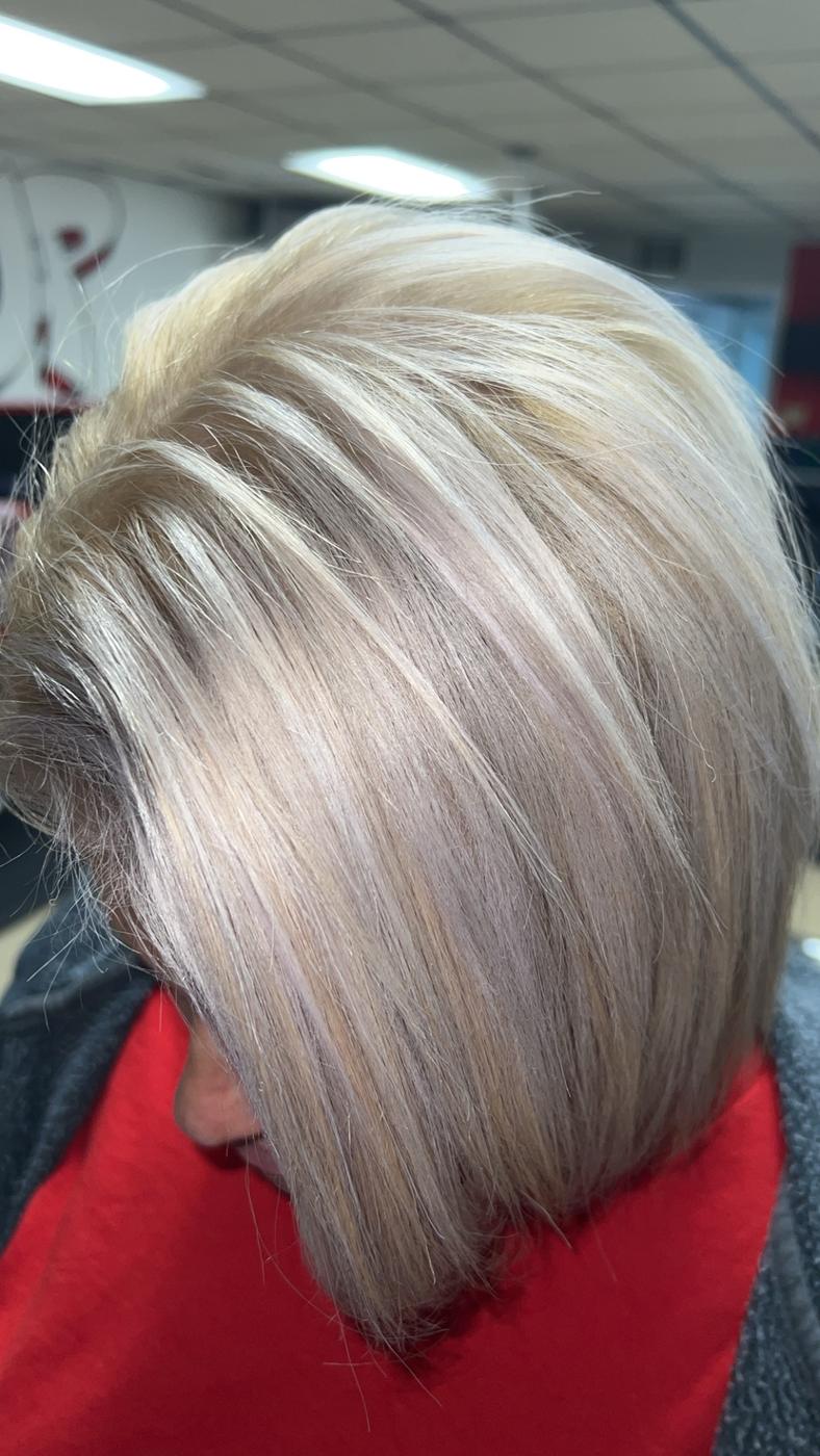 A blonde bob cut and color done at Levels Up