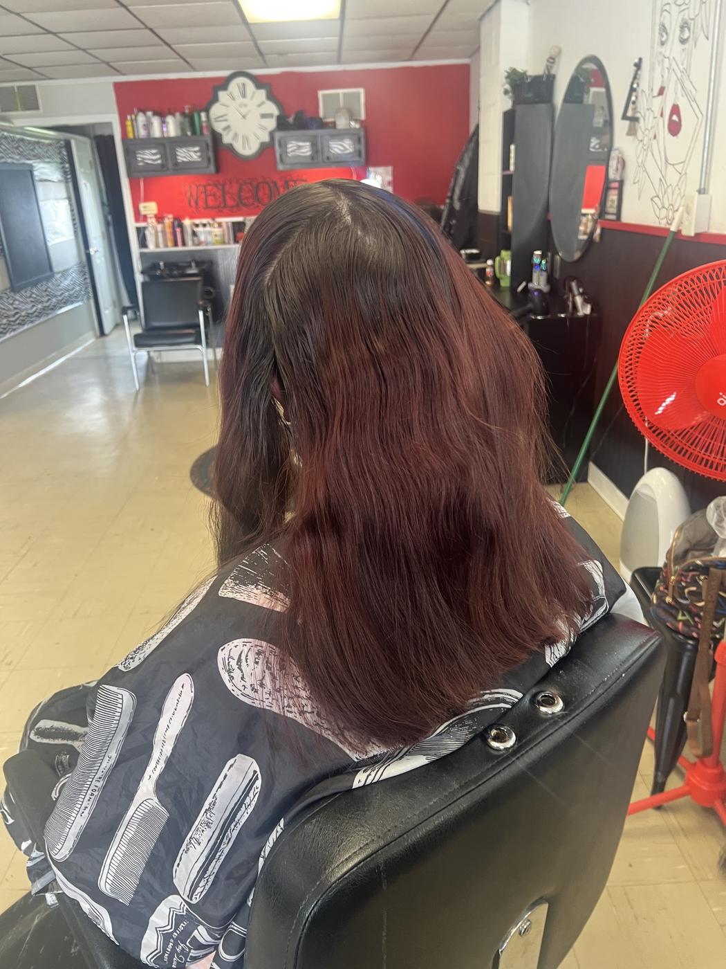 Rich burgundy hair color, shot inside the Levels Up salon