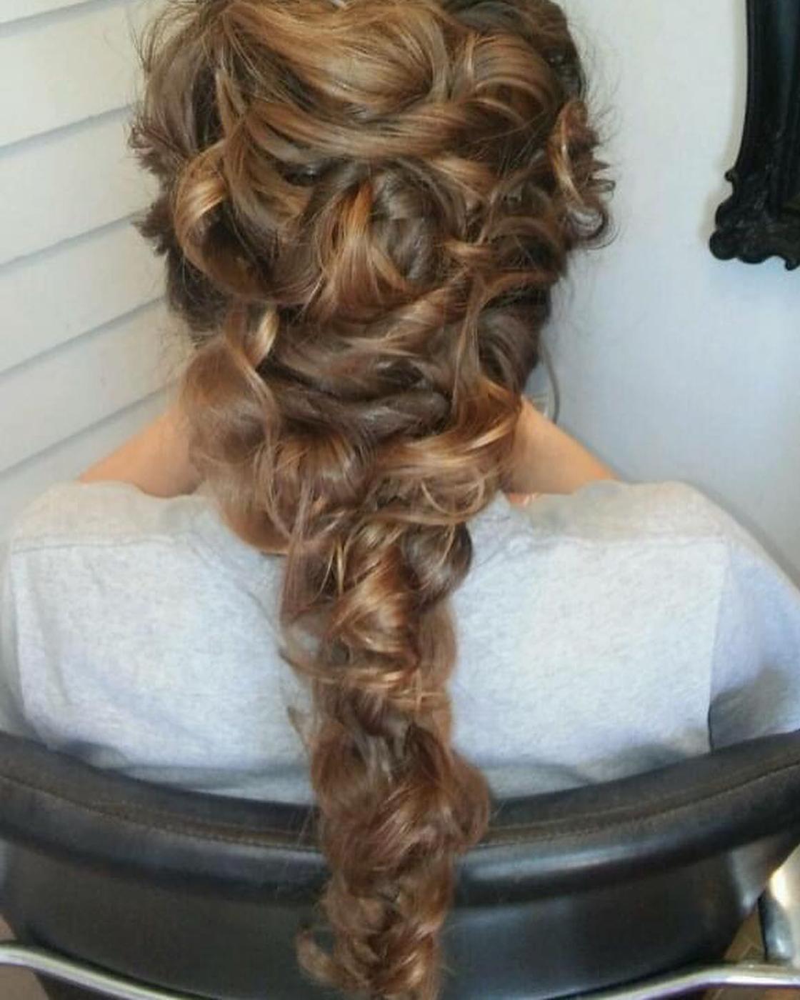 An elaborate curled updo styled at Levels Up