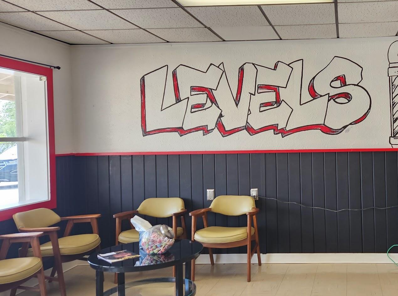 The hand-painted LEVELS wall mural inside the Levels Up waiting area