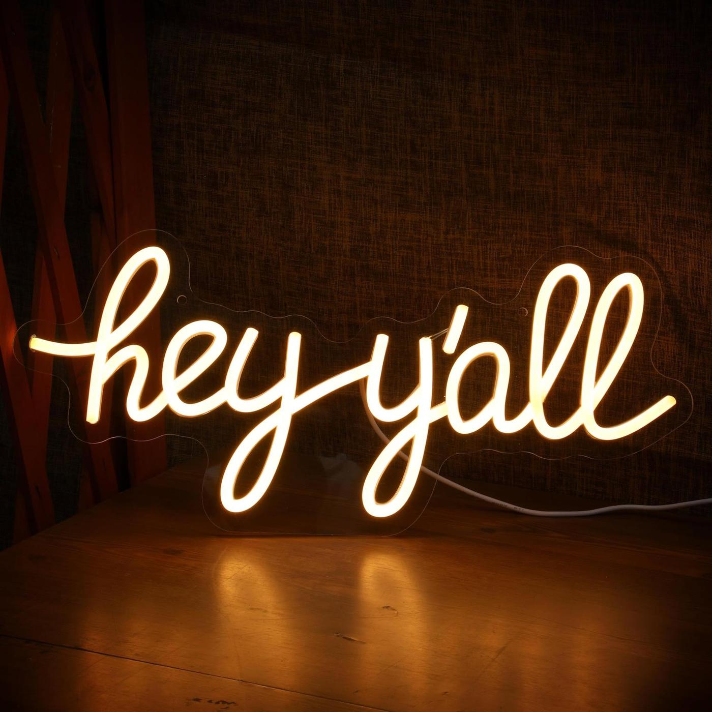A 'hey y'all' neon sign, part of the Levels Up salon decor